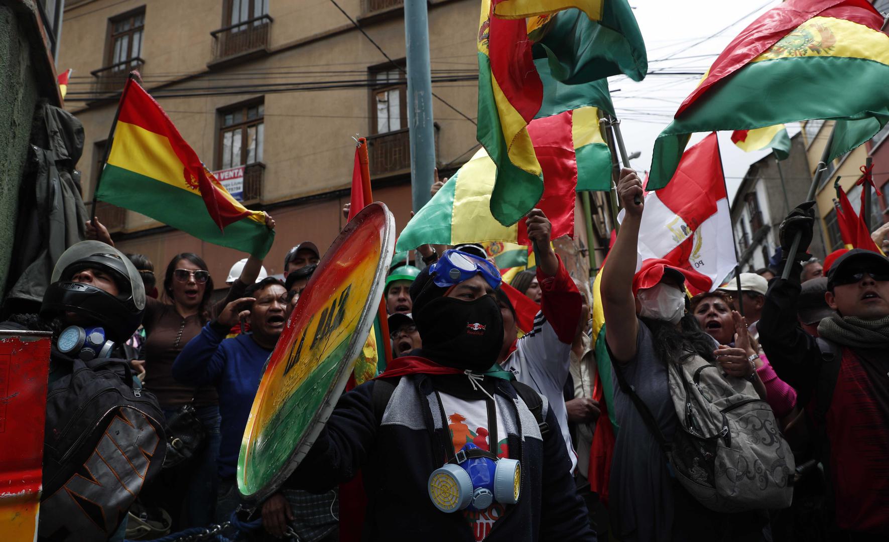 Anti-government protesters against the reelection of President Evo Morales gather just meters away from the presidential palace in La Paz, Bolivia, on Saturday, November 9, 2019.