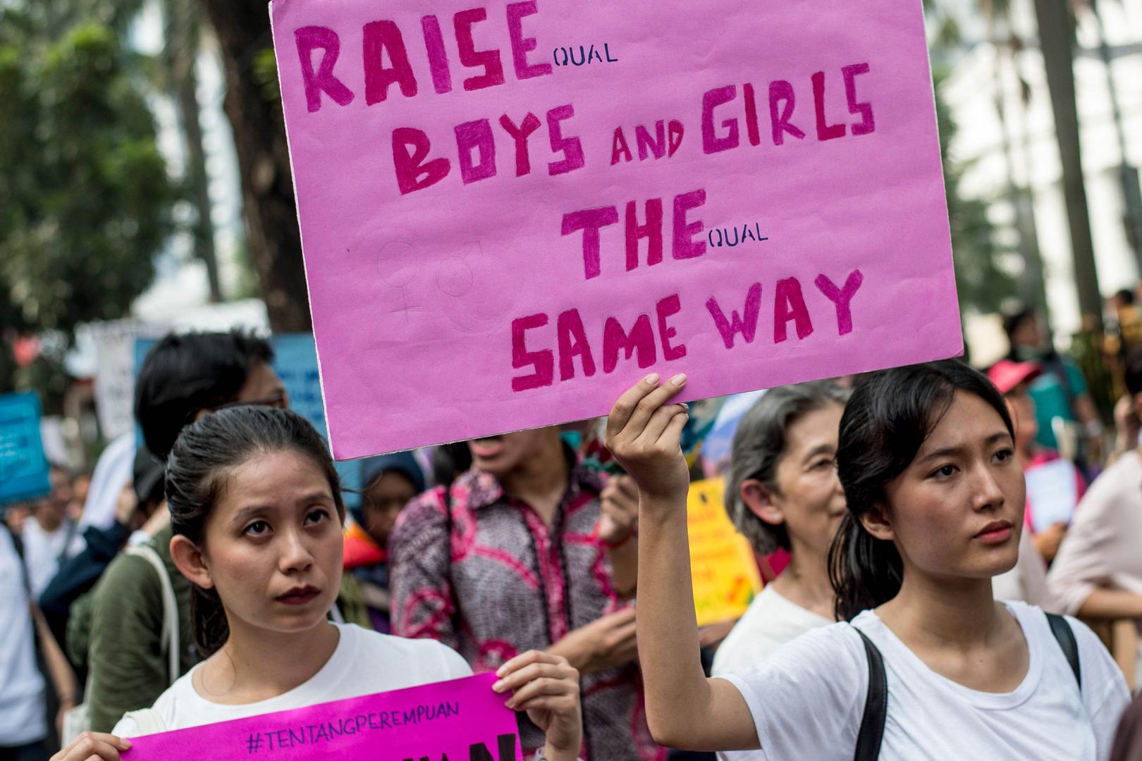 People take part in the 2018 Women's March rally in Jakarta on March 3, 2018. The participants were demonstrating for equal rights and an end to violence against women.