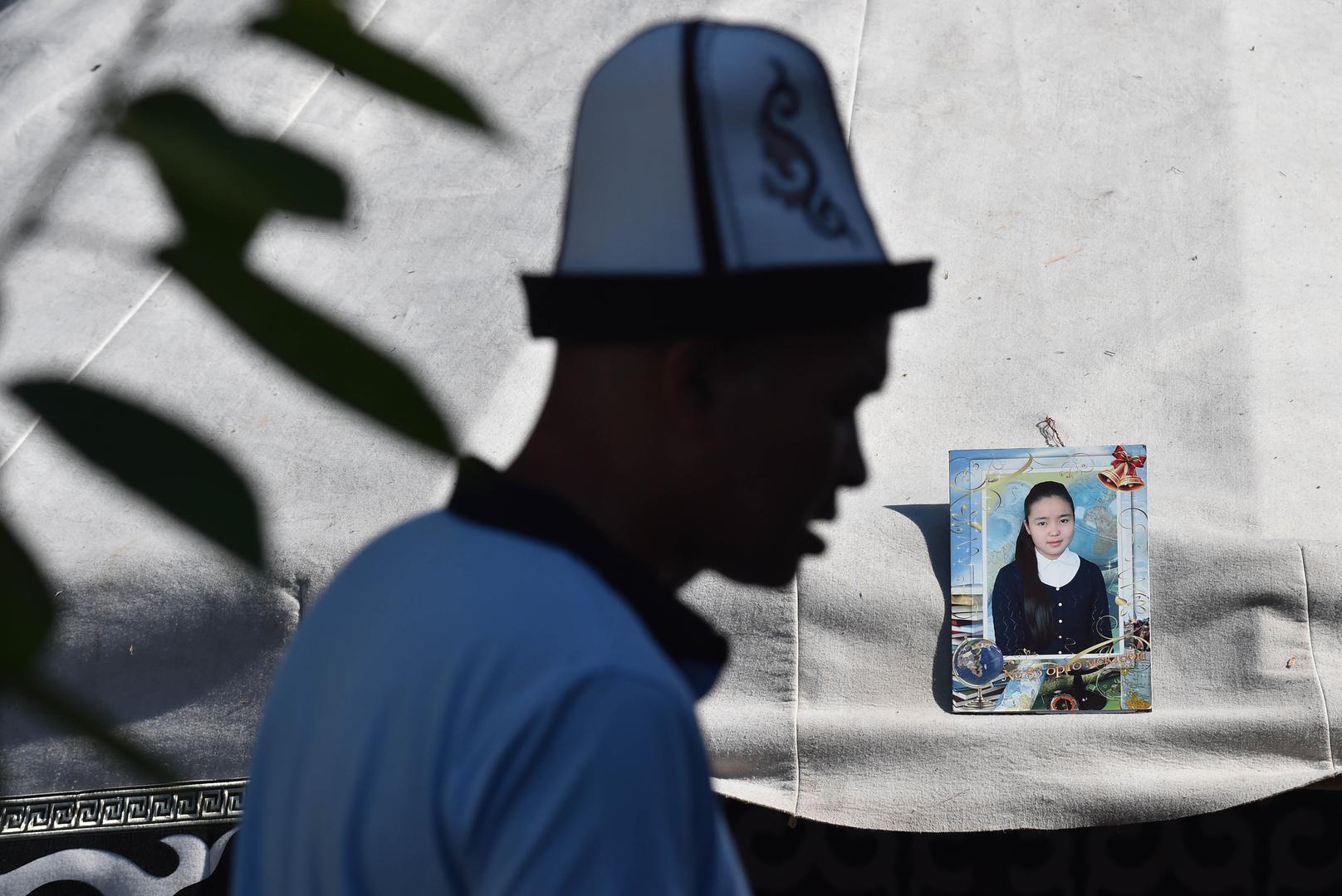 Relatives of Burulai Turdaaly Kyzy, a 20-year-old medical student, hold a traditional ceremony marking 40 days since she was murdered in a police station by her kidnapper.
