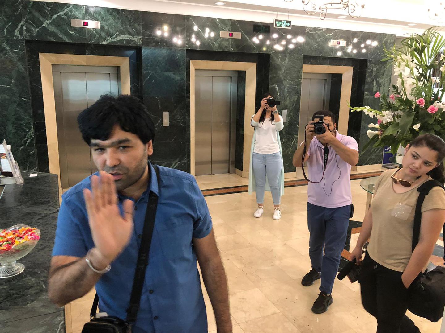 Video blogger Sardor Kamilov (left) accosts Human Rights Watch researcher Steve Swerdlow at a hotel in Tashkent, Uzbekistan, June 13, 2019.
