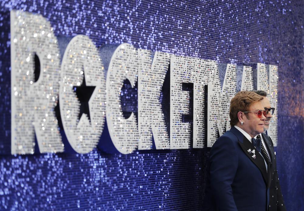 Musician Elton John and producer David Furnish, right, arrive for the UK Film Premiere of Rocketman at the Odeon Luxe in London, Monday, May 20, 2019.