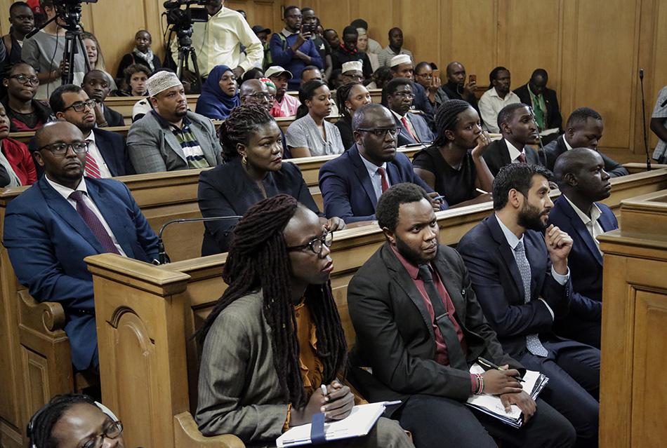 Environmental activists and petitioners listen to a tribunal ruling over the construction of a coal-fired power plant, at the supreme court building in Nairobi, Kenya