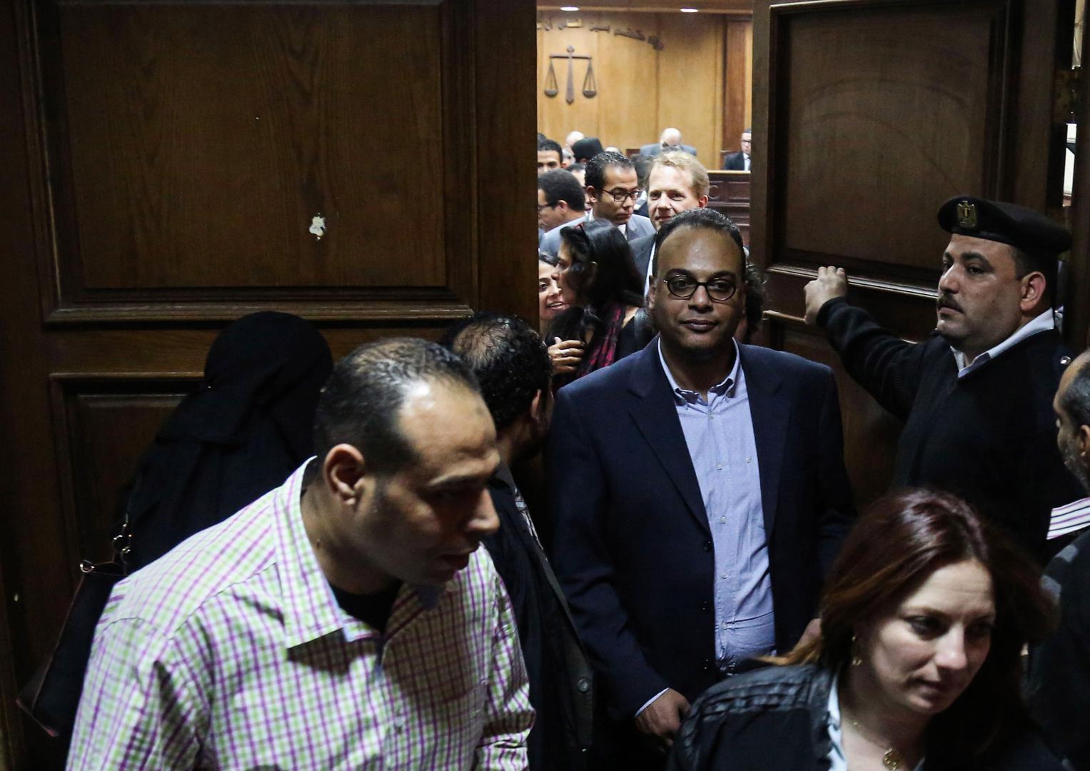 Prominent rights activist and journalist Hossam Baghat, center, leaves a courtroom at the Cairo Criminal Court on March 24, 2016. In recent years, Egyptian authorities have relentlessly prosecuted leading human rights and civil society activists for their