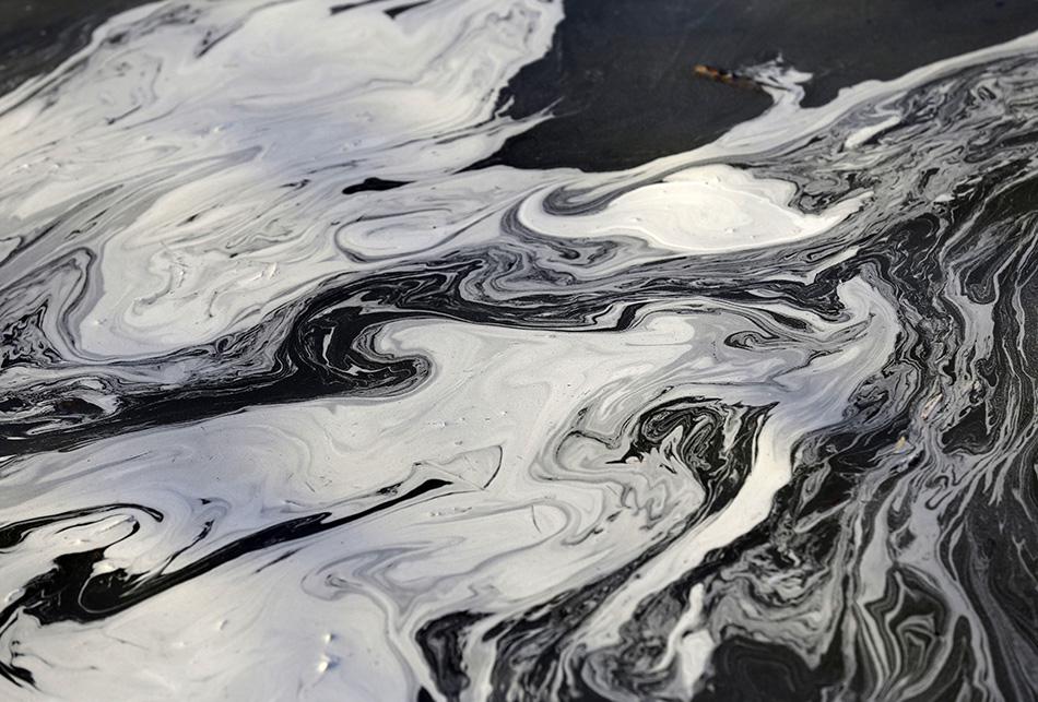 Coal ash swirls on the surface of the Dan River in Danville, Virginia