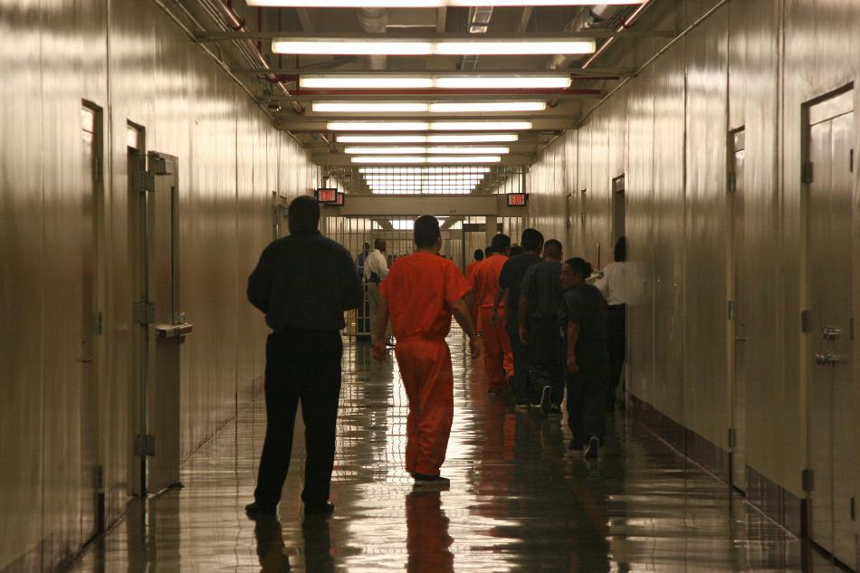 In this April 13, 2009 file photo, detainees leave the the cafeteria at the Stewart Detention Facility immigration facility in Lumpkin, Georgia.