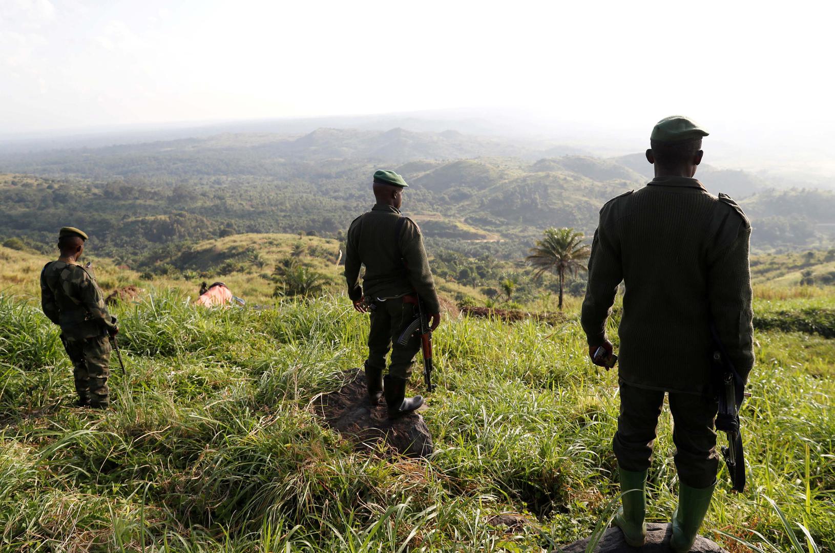 Congolese soldiers stand in a field camp in Paida, near Beni, North Kivu province, Democratic Republic of Congo, on December 7, 2018.