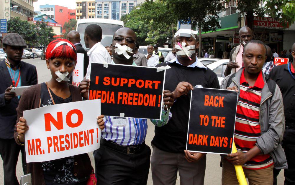 Kenyan journalists wear tape over their mouths to signify being silenced