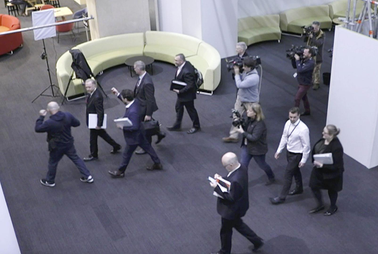Australia's Federal Police enter the Australian Broadcasting Corporation, the national public broadcaster, during a raid on their offices in Sydney, Australia. (Australian Broadcasting Corporation via AP, File).
