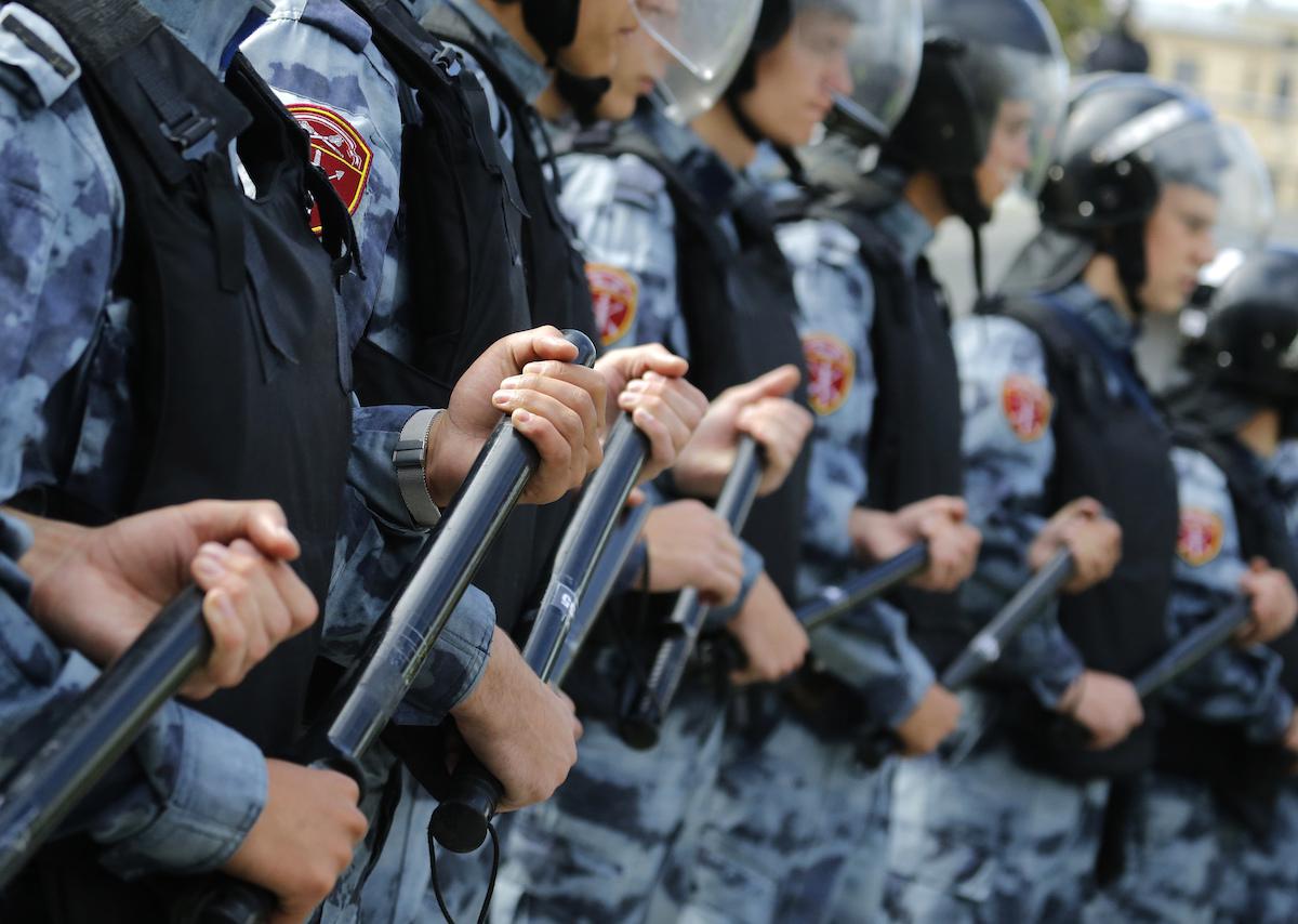 Police block a square during a peaceful protest in the center of Moscow, Russia, Saturday, Aug. 3, 2019.