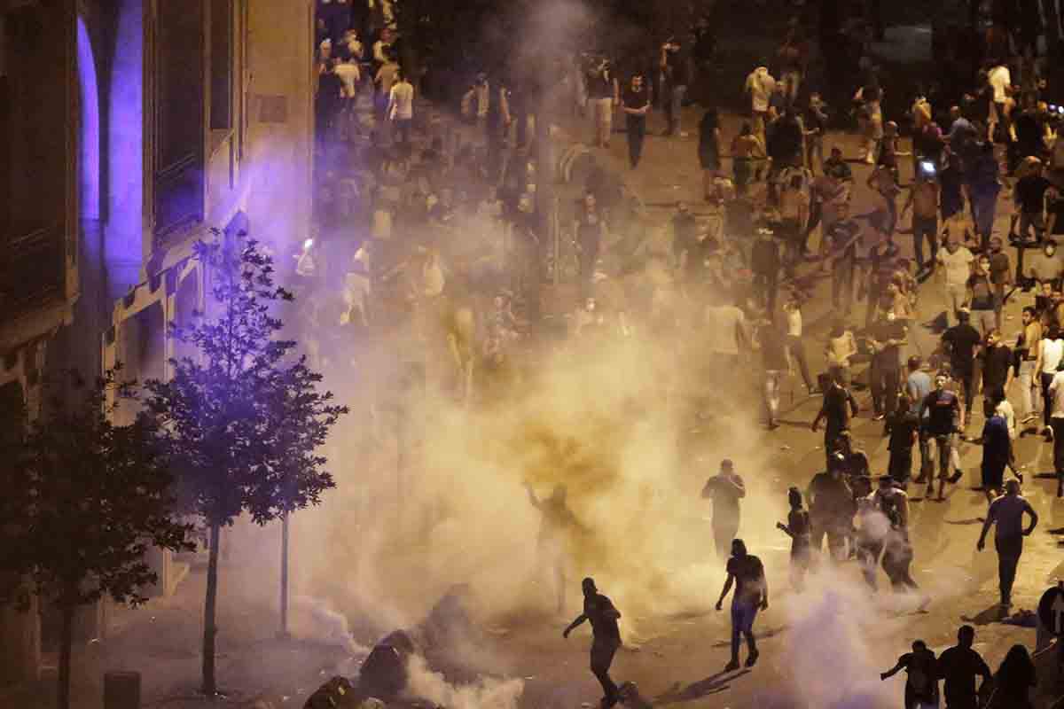 Lebanese riot police fire tear gas during a protest against government's plans to impose new taxes in Beirut, Lebanon, October 18, 2019. 