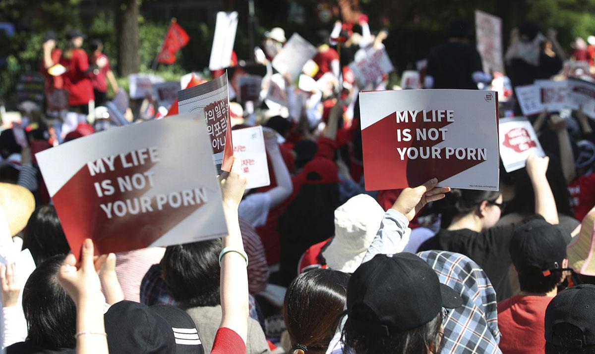 Women protest to demand stronger government action to fight the spread of intimate photos and footage taken by hidden cameras in Seoul, South Korea, July 7, 2018.