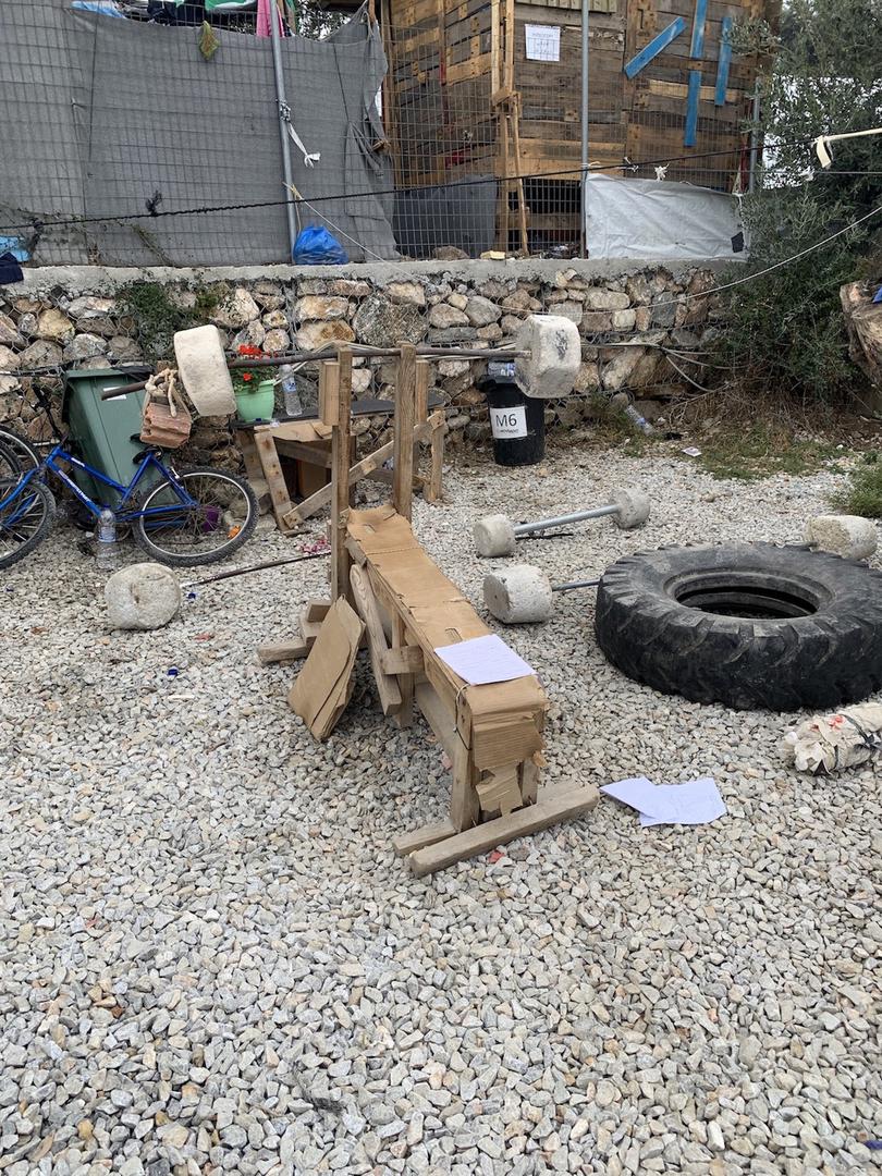 A makeshift gym created by asylum seekers living in Moria is located in the Olive Grove. Lesbos, Greece, October 2019. 