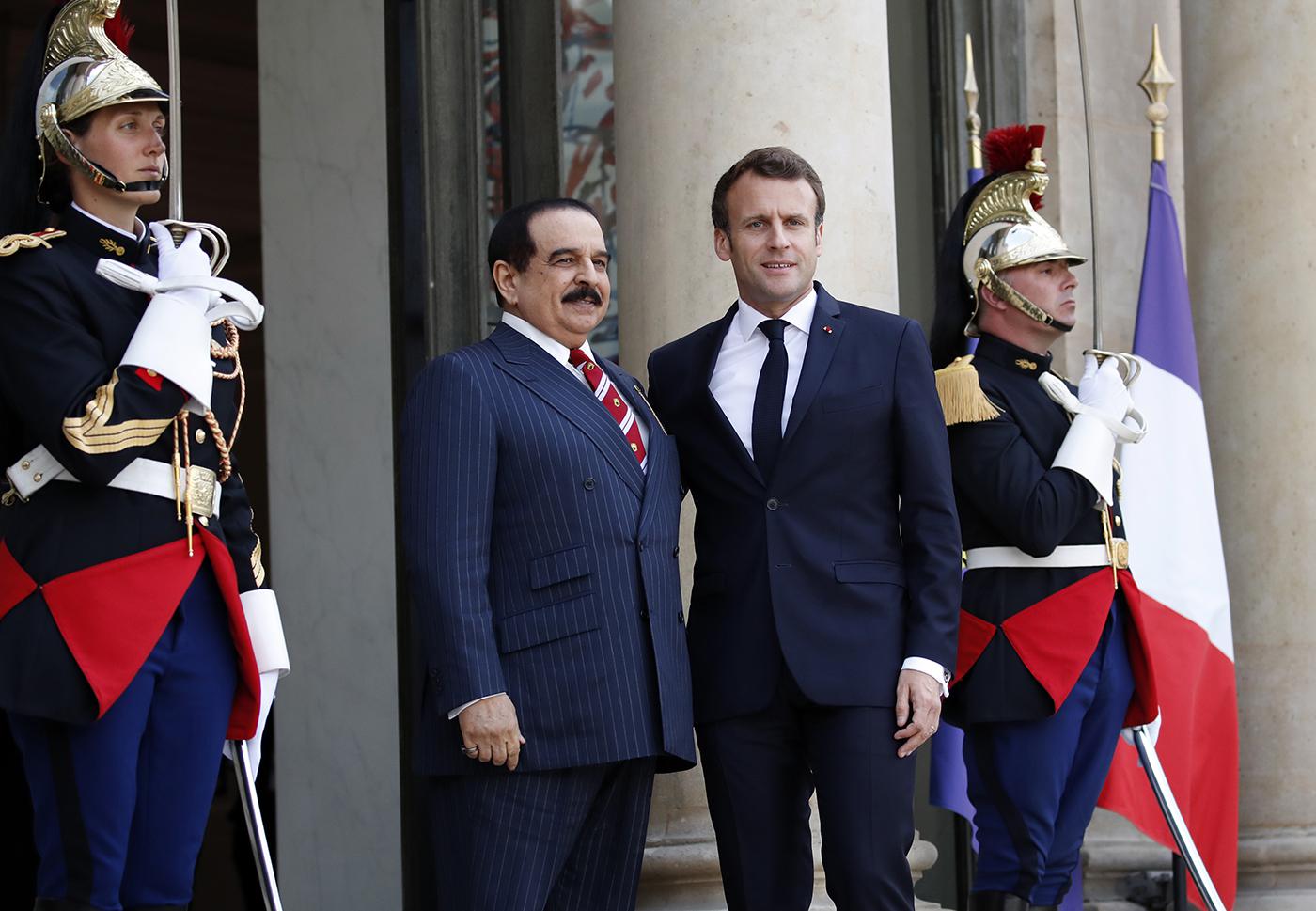 Bahrain's King Hamad bin Isa Al Khalifa, left, is greeted by French President Emmanuel Macron before a meeting at the Elysee Palace in Paris, Tuesday, April 30, 2019.