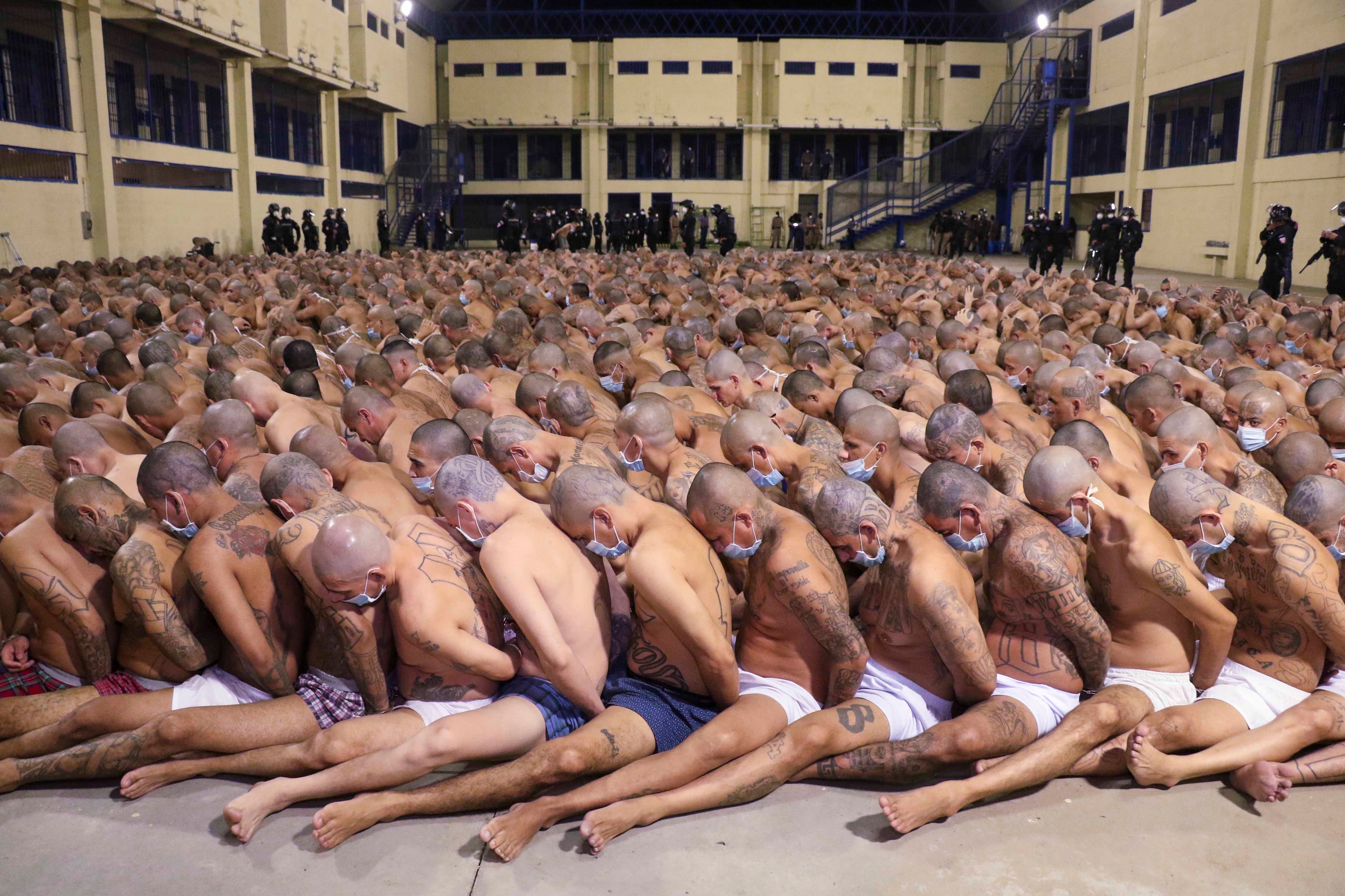 Inmates are lined up during a security operation under the watch of police at Izalco prison in San Salvador, El Salvador, on April 25, 2020.