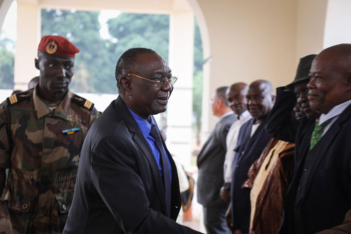 Former Central African Republic president Michel Djotodia (C) is received in Bangui on January 10, 2020 by political supporters.