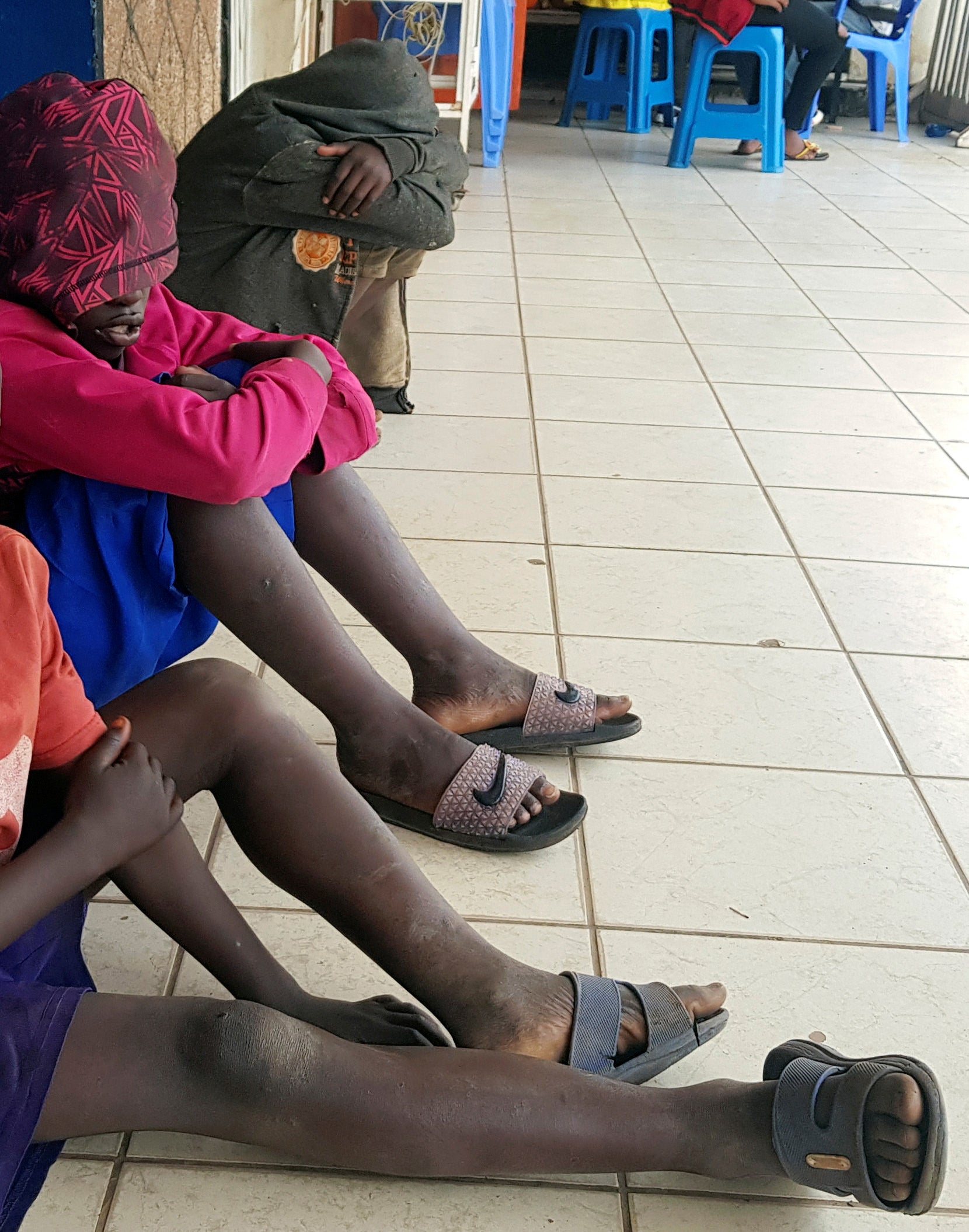 Street children sit on the verandah of a house in Kigali, Rwanda’s capital city, on January 22, 2020.