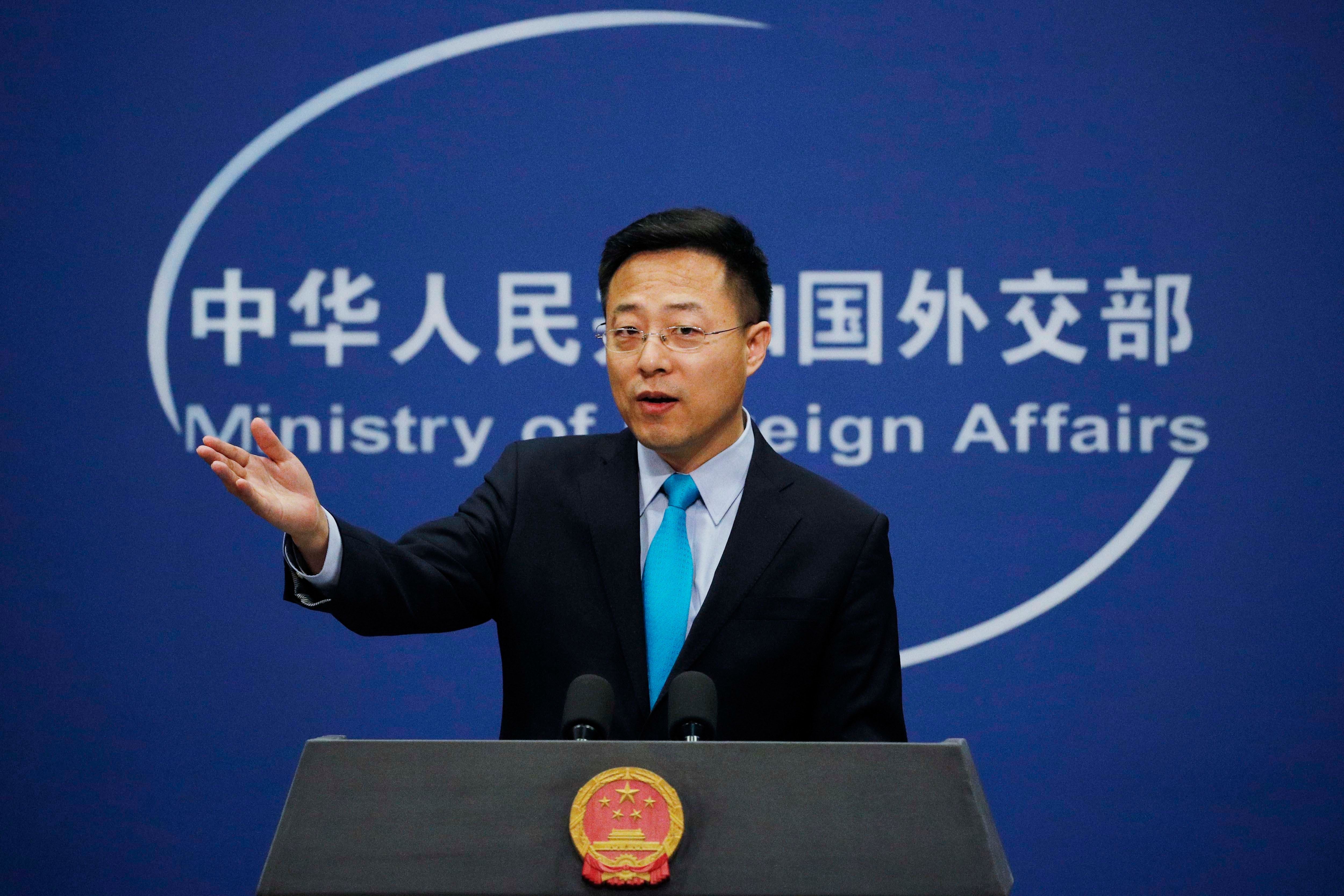 Chinese Foreign Ministry new spokesman Zhao Lijian gestures as he speaks during a daily briefing at the Ministry of Foreign Affairs office in Beijing, February 24, 2020. 