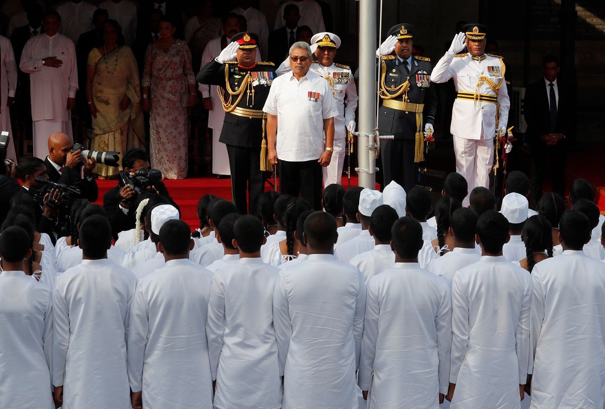 Sri Lankan President Gotabaya Rajapaksa, center, sings the national anthem during an event to mark the anniversary of country's independence from British colonial rule in Colombo, Sri Lanka, Tuesday, Feb. 4, 2020. (AP Photo/Eranga Jayawardena)