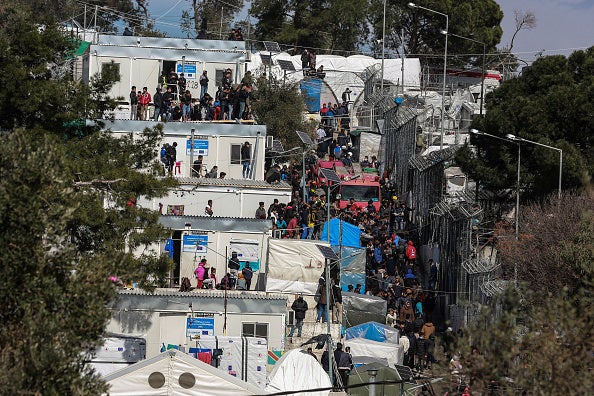 Asylum seekers and migrants in the Reception and Identification Center of Moria, Lesbos after a fire broke out, on March 16, 2020. 