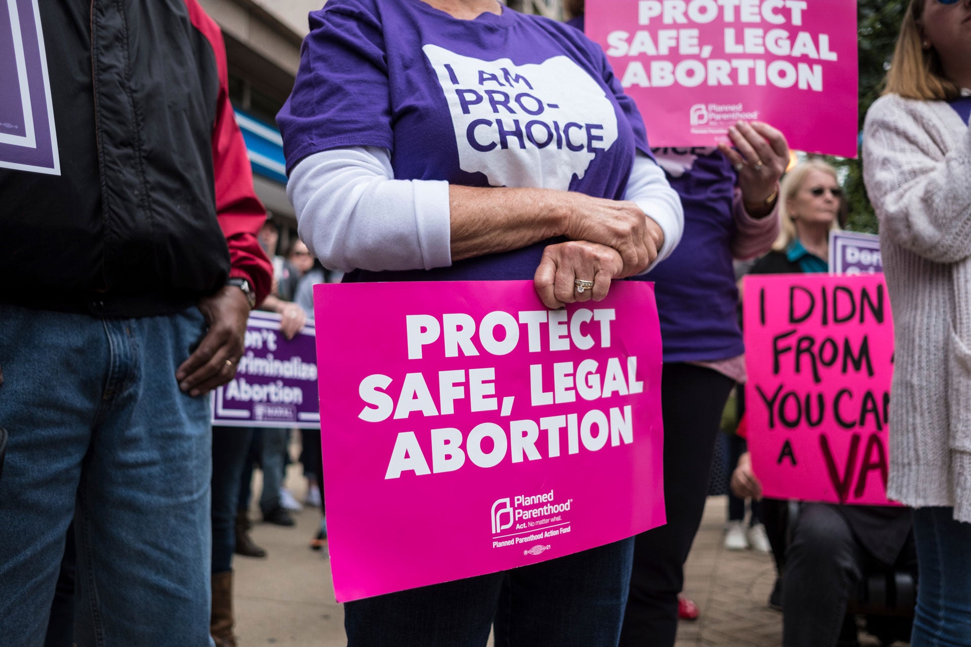 An activist seen holding a placard that reads, "protect safe, legal abortion" during a Stop the Bans rally in Dayton, Ohio, May 19, 2019.
