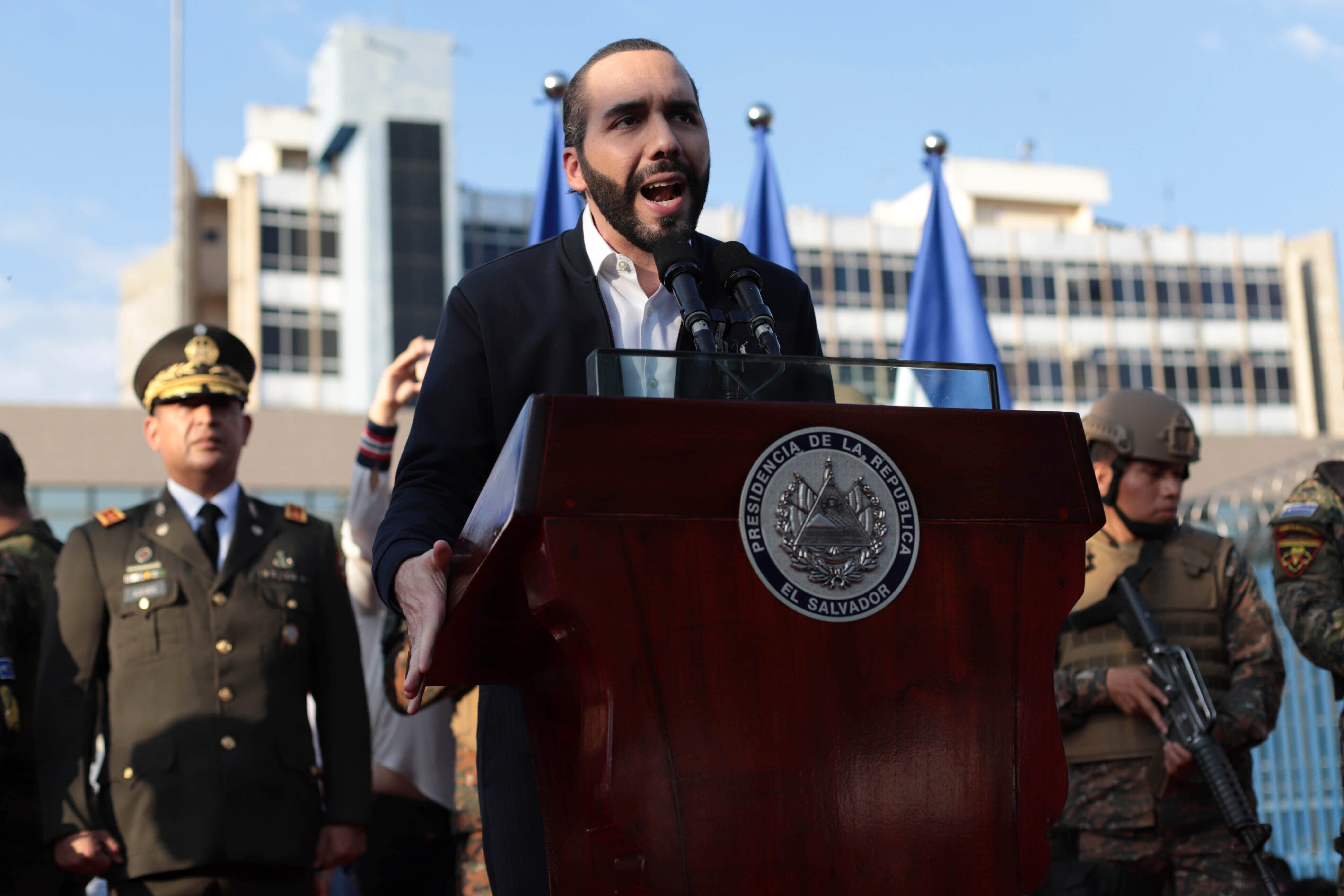 El Salvador's President Nayib Bukele, accompanied by members of the armed forces, speaks to his supporters outside Congress in San Salvador, El Salvador.