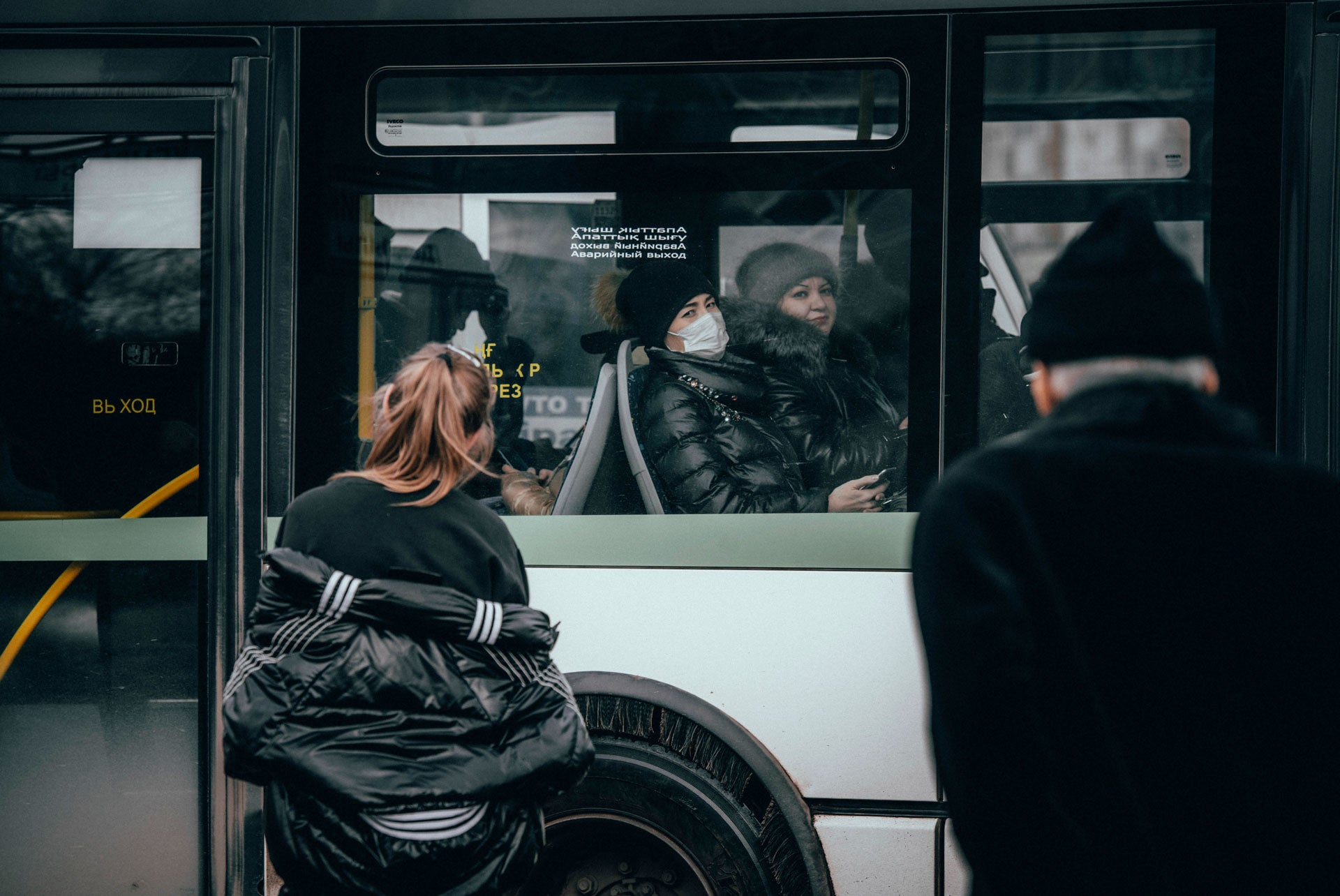 A woman rides a bus wearing face protective mask amid concerns over the coronavirus, in Nur-Sultan, Kazakhstan, March 16, 2020. 