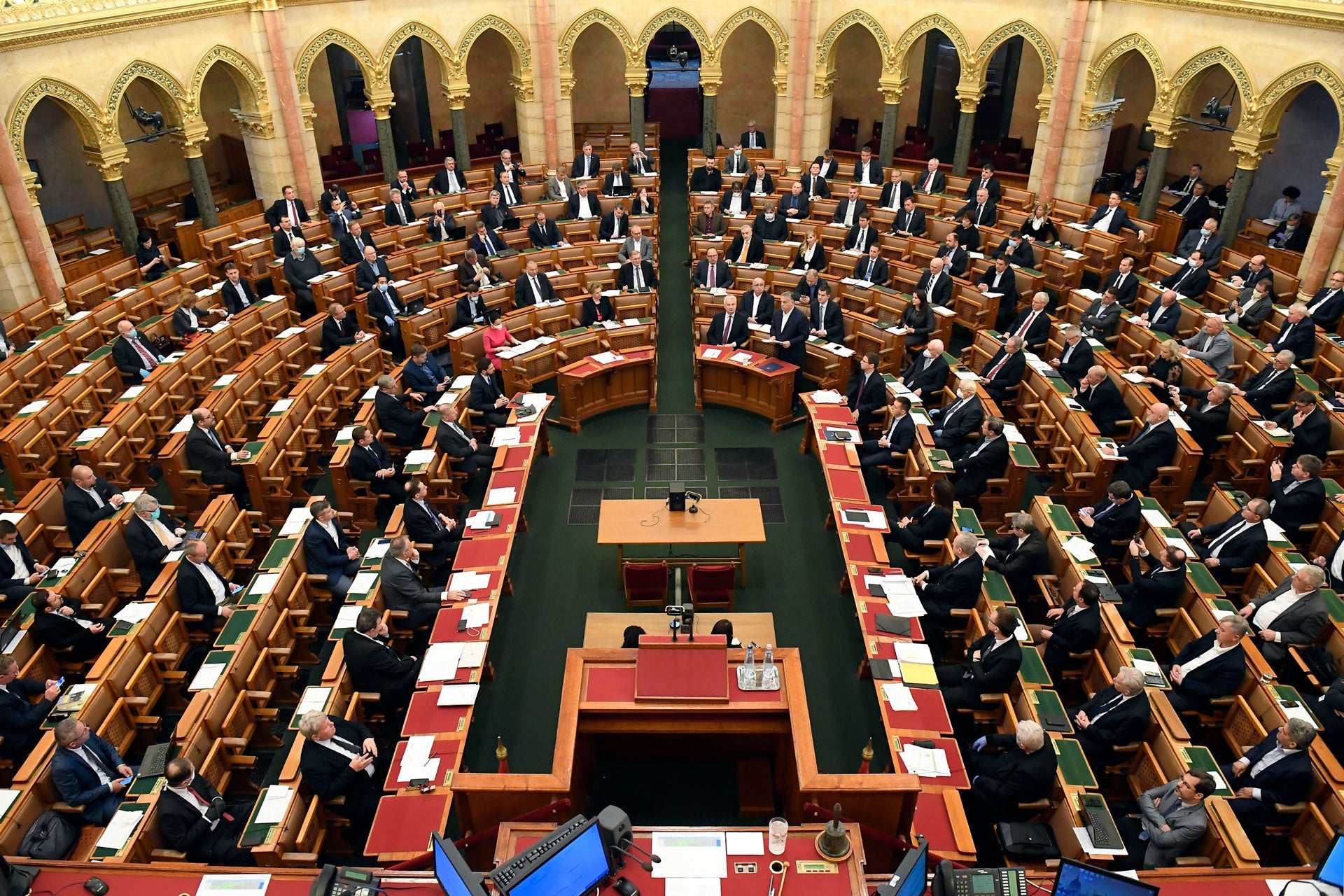 Hungarian Prime Minister Viktor Orban, center right, speaks during a plenary session in the House of Parliament in Budapest, Hungary, Monday, March 23, 2020.