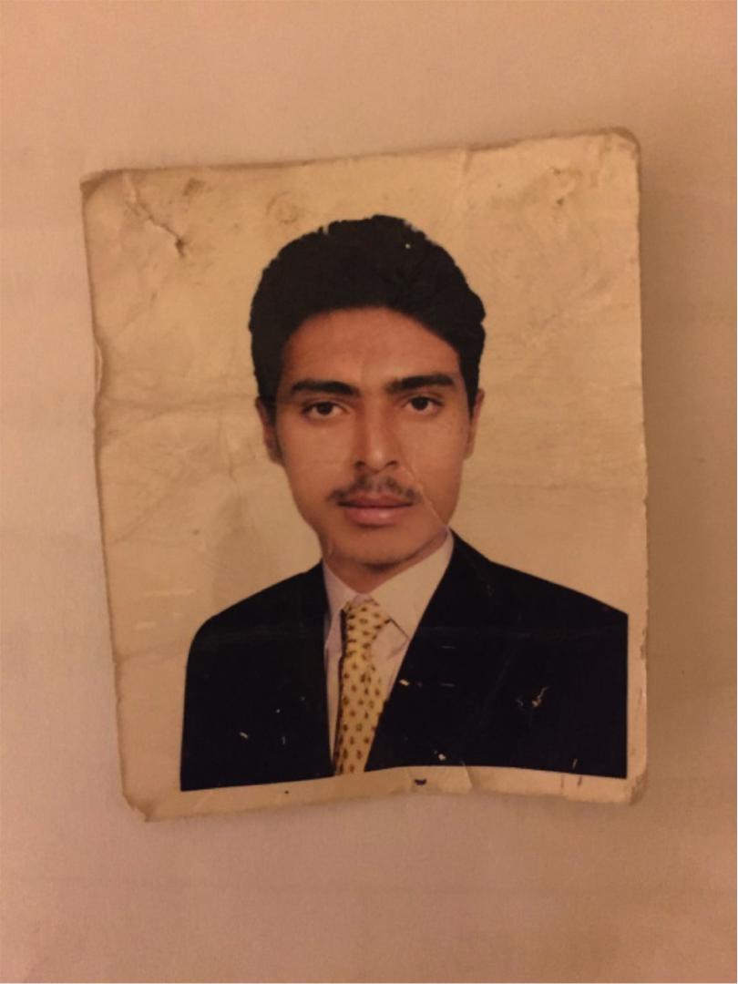 An undated  photo of Ahmad Ali Ayed al-Jershi, 27, found among the debris of his home after an initial airstrike on the residential neighborhood of al-Asbahi in Sanaa on September 23, 2015. Al-Jershi died in the airstrike. 