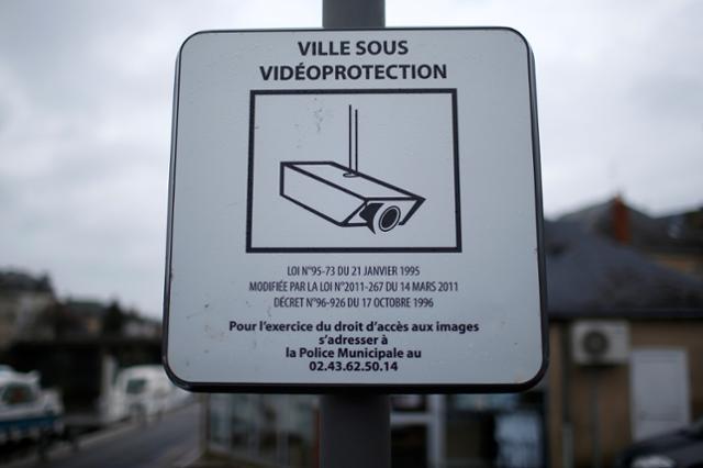A plaque indicates a public surveillance viedeo camera in Sable-sur-Sarthe, western France, January 31, 2017.