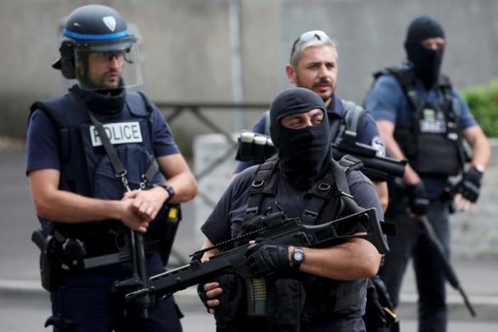 French police and anti-crime brigade (BAC) members secure a street as they carried out a counter-terrorism swoop at different locations in Argenteuil, a suburb north of Paris, France, July 21, 2016. 