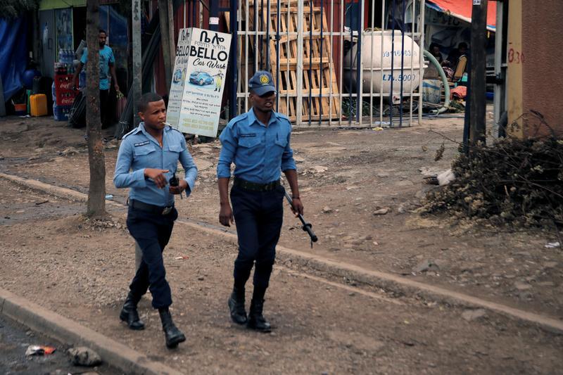 Police officers patrol along a road in Addis Ababa, Ethiopia, February 21, 2018. © 2018 Reuters