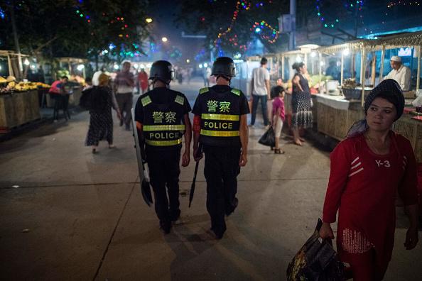 Chinese police patrolling night market near Id Kah Mosque in Kashgar in China's Xinjiang Uighur Autonomous Region, a day before the Eid al-Fitr holiday on June 25, 2017. 