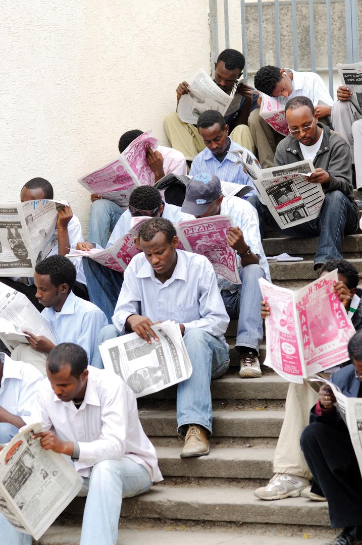 Newspaper readers at Arat Kilo, a square in Addis Ababa, Ethiopia.