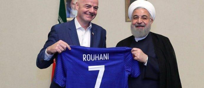 Iranian President Hassan Rouhani receiving a present from FIFA president Gianni Infantino during their meeting at the presidential office in Tehran, Iran, on March 1 2018. Handout photo, Iranian Presidential Office.Iranian President Hassan Rouhani receivi