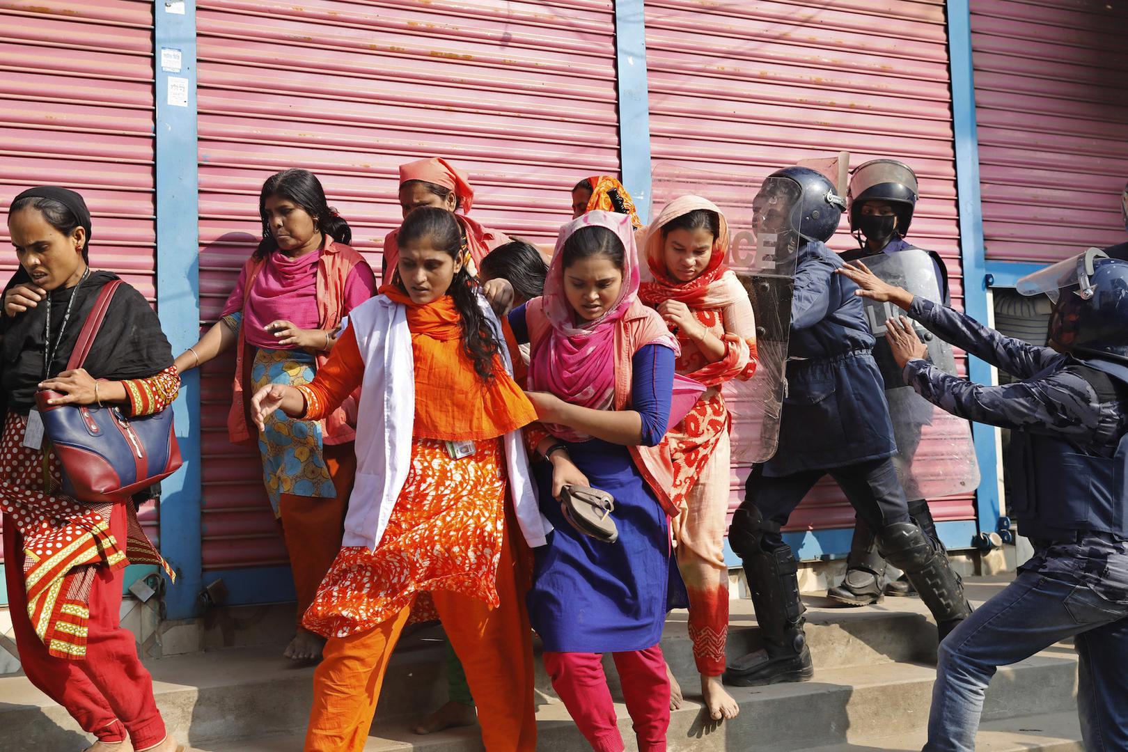 Bangladesh police chase protesting garment workers in Savar, outside Dhaka, Bangladesh, January 9, 2019.