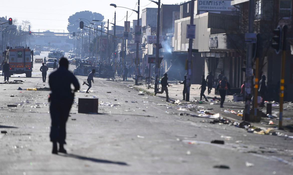 Stones and bricks are seen on a street on the outskirts of Johannesburg, Monday Sept. 2, 2019. Police had earlier fired rubber bullets as they struggled to stop looters who targeted businesses as unrest broke out in several spots in and around the city. 