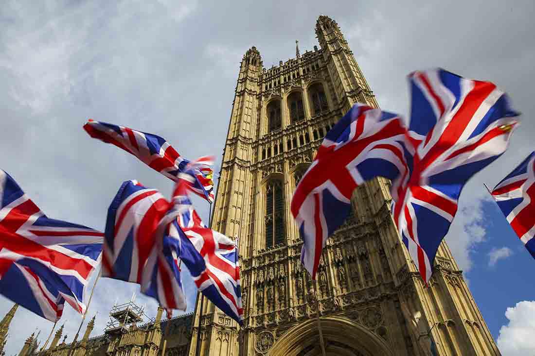 Union Jack flags fluttering outside Houses of Parliament in Westminster, London, October 1, 2019.