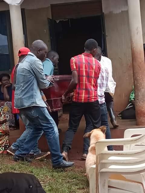 Relatives of Brian Wasswa carry his coffin during his funeral on October 6, 2019.