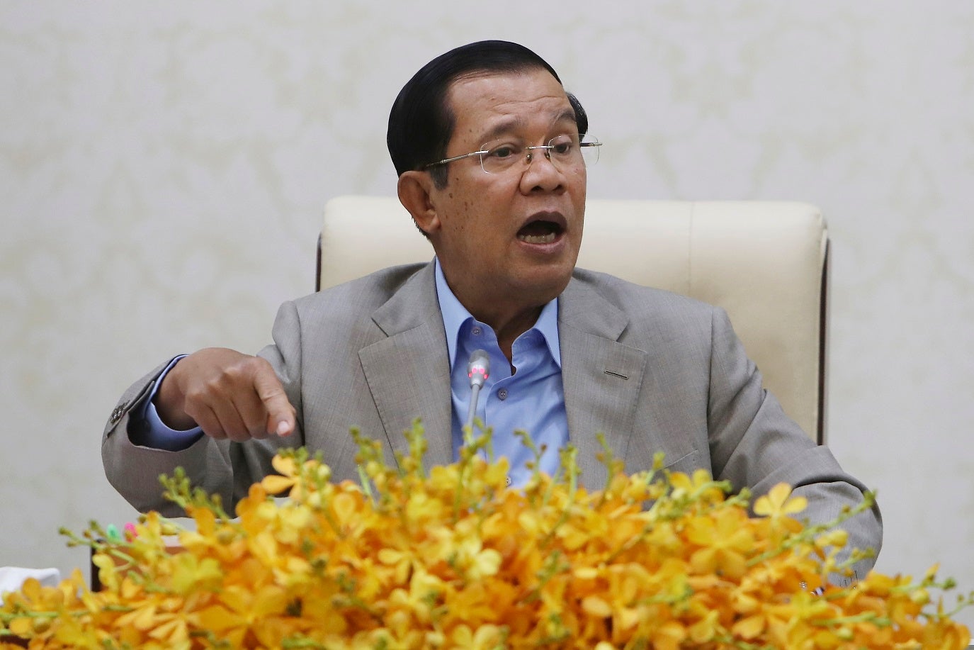 Cambodia's Prime Minister Hun Sen gestures during a speech on the current state of a new virus from China in Phnom Penh, Cambodia, Thursday, Jan. 30, 2020.