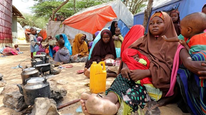 Somali families, displaced after fleeing the Lower Shabelle region amid an uptick in US airstrikes, rest at an internally displaced persons camp near Mogadishu, Somalia, March 12, 2020. © March 12, 2020 REUTERS/Feisal Omar. 