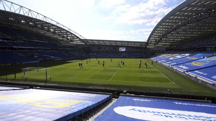 Newcastle United players warm up before the Premier League match at the Amex Stadium, Brighton, United Kingdom on July 20, 2020.