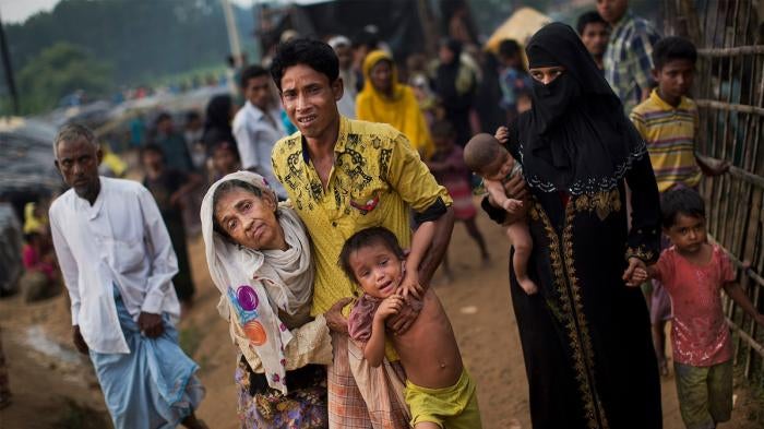 Rohingya family arriving at refugee camp
