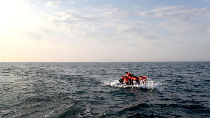 A group of people thought to be migrants crossing the Channel in a small boat headed in the direction of Dover, Kent, United Kingdom, August 10, 2020.
