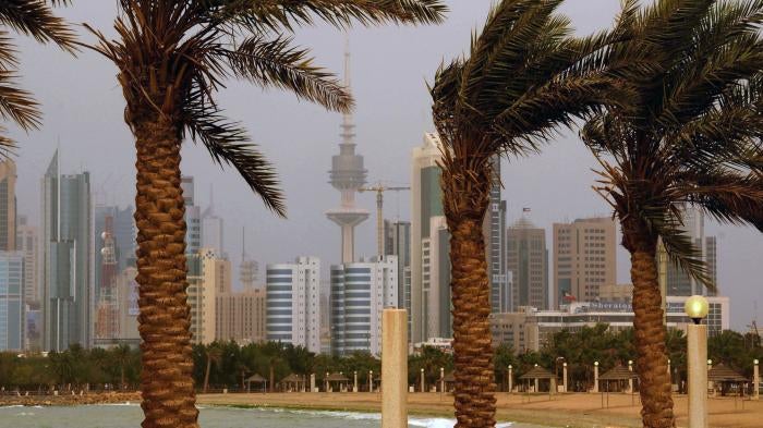 The Kuwait city skyline is seen through the haze of a sand storm in Shuwaikh, Kuwait City.