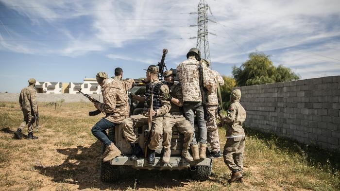 Fighters of Libya's UN-backed Government of National Accord (GNA) during clashes at the Ain Zara frontline, in the southern suburbs of capital Tripoli, with the forces of the Libyan National Army (LNA).
