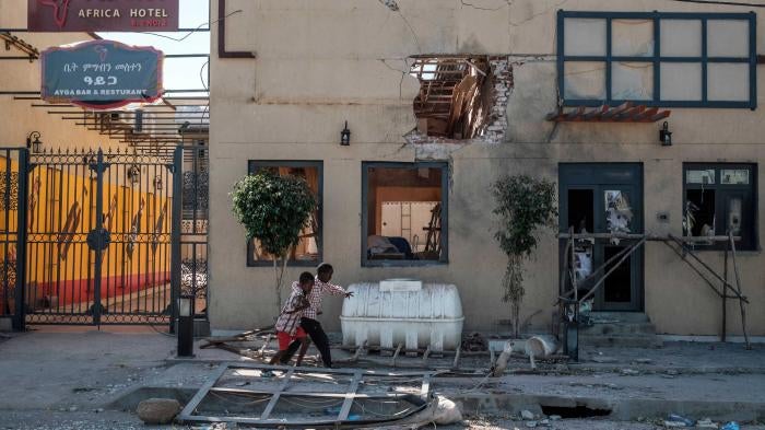 Children in front of the Africa/Ayga hotel likely damaged by a direct fire weapon in Humera town, Tigray region, Ethiopia, on November 22, 2020.