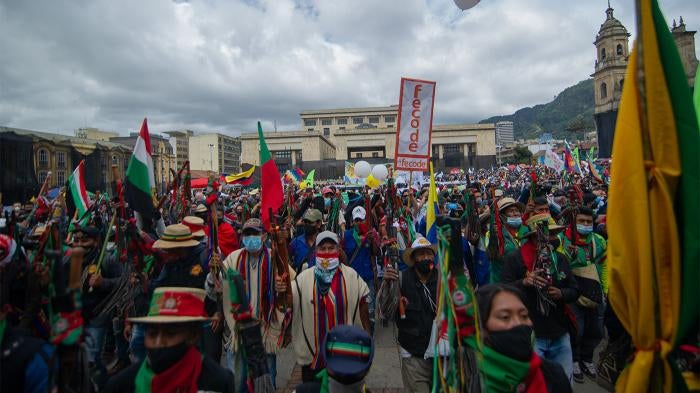 Indigenous peoples and others participate in a demonstration calling for better government protection of people in the country’s remote communities, on October 21, 2020, in Bogotá, Colombia. Indigenous people have been disproportionately affected by killings of human rights defenders in Colombia.