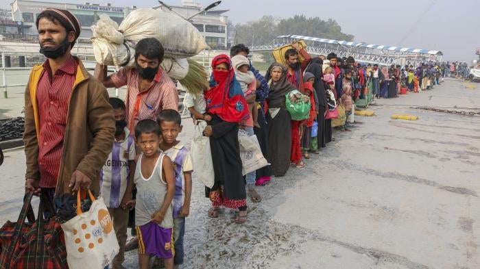 Rohingya refugees headed to the Bhasan Char island prepare to board navy vessels from the south eastern port city of Chattogram, Bangladesh on Feb.15,2021. © 2021 AP Photo 