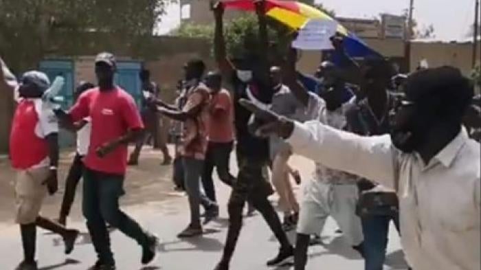 People in the streets of N'Djamena, Chad’s capital, protest against President Idriss Déby Itno running for a sixth term in the April 11, 2021 election.