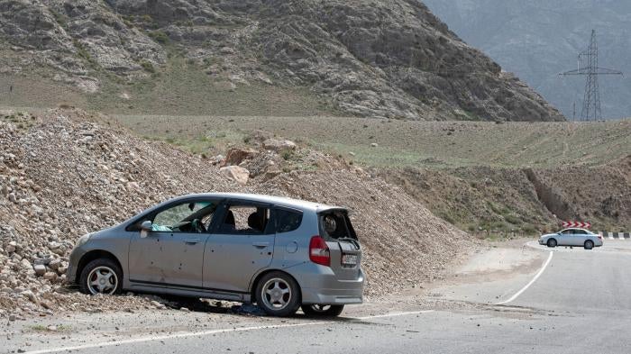 Cars damaged during a firefight on the Kyrgyz-Tajik border are seen near the settlement of Koi-Tash, Batken region, Kyrgyzstan, April 30, 2021.